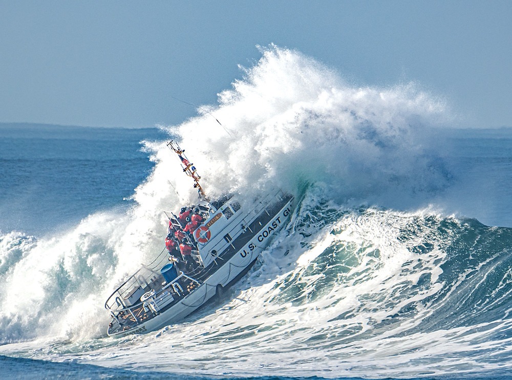 Photo: Motor lifeboat Victory heads into the breakers.
