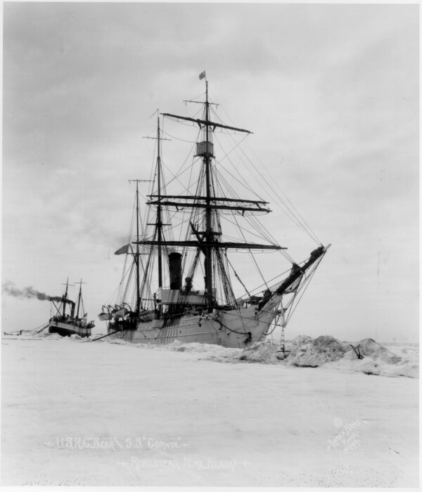 Photo: The Bear is seen sitting in the ice while another vessel is seen in the background.