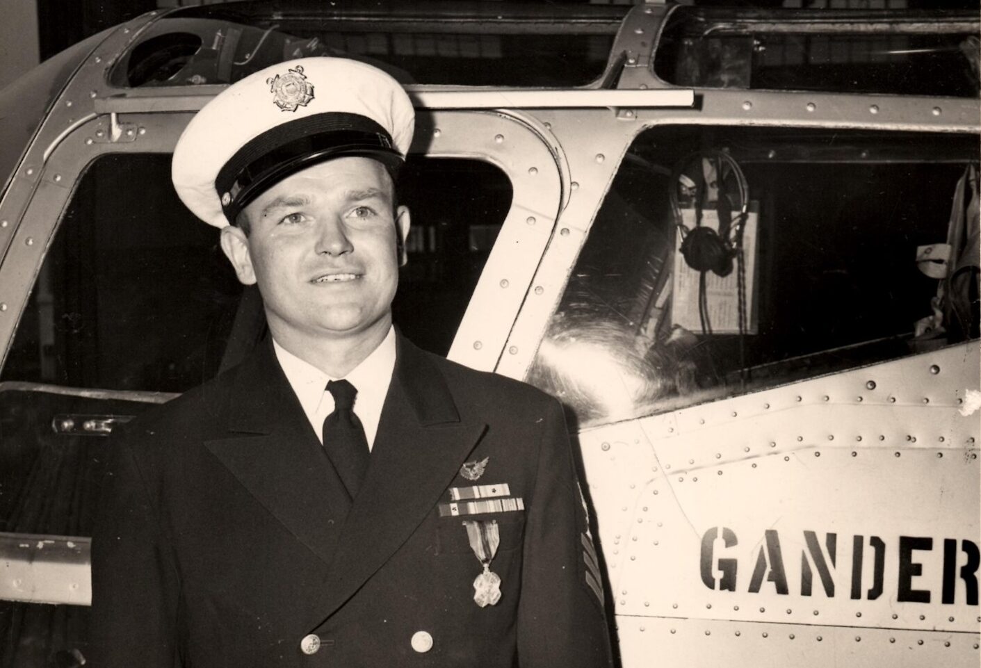 Photo: Gus Jablonski shows off his decoration while posing next to the Gander Express.