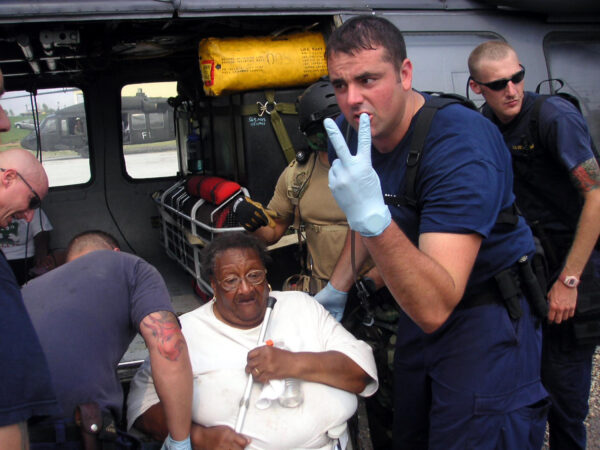 Photo: An aircrew loading victims onto an Army Black Hawk helicopter.