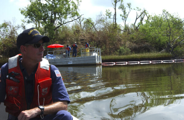 Photo: U.S. Coast Guard safety officer navigates through flooded area.