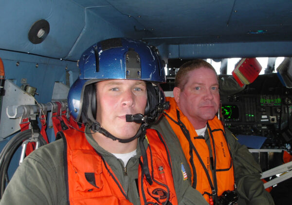 Photo: Rescue Swimmer Chas Mitchell of Coast Guard Air Station San Diego and Auxiliarist Gary Johnson on a Hurricane Katrina rescue mission in an HH60.