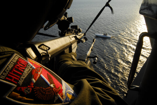 Photo: Gunner takes aim at a fast boat with a decommissioned .50 caliber precision rifle during training.