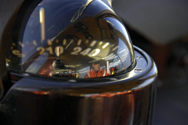 Photo: A closeup of a ship's compass.