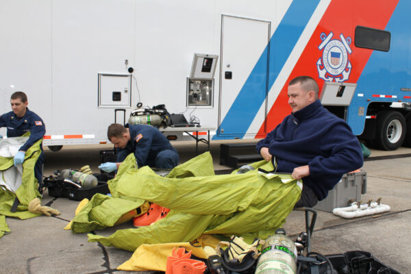 Photo: Team members dress-out in Level A HAZMAT suits during an exercise.