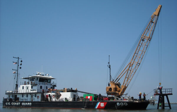 Photo: U.S. Coast Guard Cutter Pamlico and crew repair engage the crane at a center entrance range.