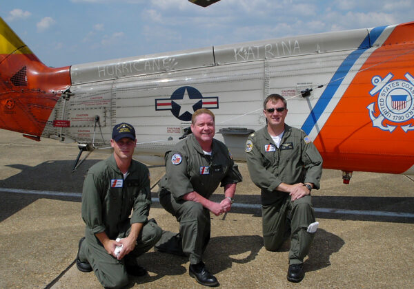 Photo: Crew poses in front of their HH60 helicopter.