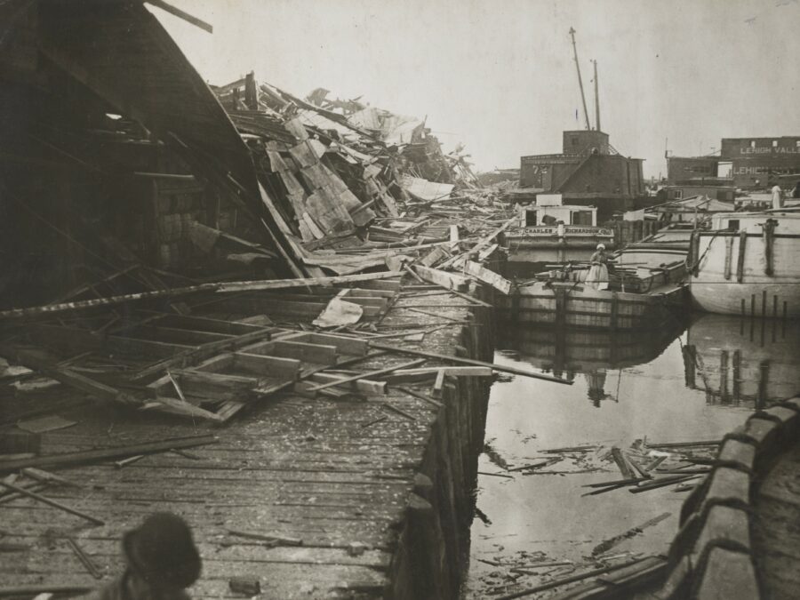Photo: Canal boats amidst the wreckage caused by munitions explosion on Black Tom Island, New Jersey. July 1916