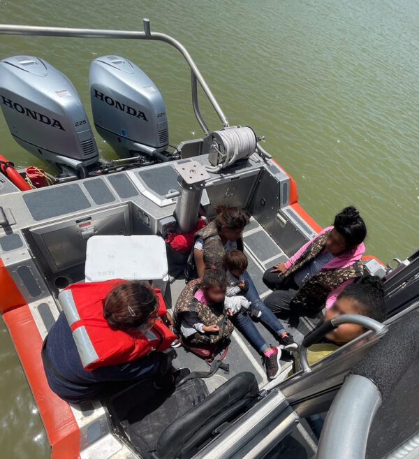 Photo: A 29-foot Response Boat–Small crew from Coast Guard Maritime Safety & Security Team Houston transports a family of aliens across the Rio Grande