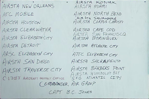 Photo: Appended to the Air Station New Orleans, LA sign is an additional sign painted white with the names of every Coast Guard air station that supported Katrina rescue operations. These are listed as AIRSTA New Orleans, ATC Mobile, AIRSTA Houston, AIRSTA Clearwater, AIRSTA Elizabeth City, AIRSTA Detroit, AIRSC Elizabeth City, AIRSTA San Diego, AIRSTA Traverse City, C130J Aircraft Project Office, AIRSTA Kodiak, AIRSTA Miami, AIRSTA North Bend, AIRSTA Savannah, AIRSTA Corpus Christi, AIRSTA Cape Cod, AIRSTA San Francisco, AIRSTA Borinquen, AIRSTA Atlantic City, ATTC Elizabeth City, AIRSTA Sacramento, AIRSTA Barbers Point, AIRSTA Humboldt Bay, SFO Atlantic City, followed by COMMANDER, AIR GROUP CAPT. B.C. Jones