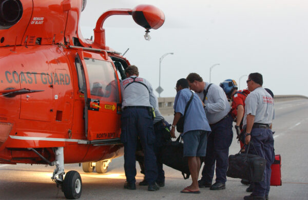 Photo: Residents board a U.S. Coast Guard helicopter