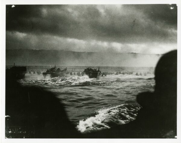 Photograph: Landing craft from the Samuel Chase landing the first wave of troops on Omaha Beach.