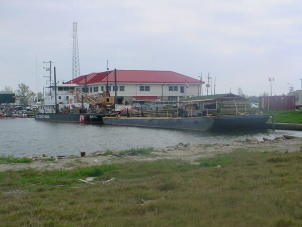 Photo: Pamlico with barge full of ATON supplies and construction materials