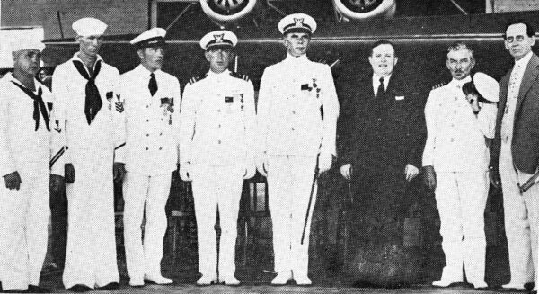 Photo: LCDR von Paulsen and crew of Arcturus in dress uniform at awards ceremony.