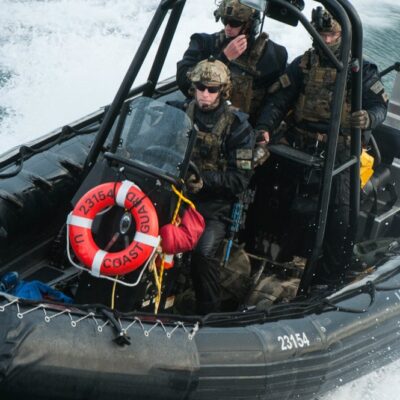 Photo: MSRT members deployed in a special rigid-hull inflatable patrol boat.