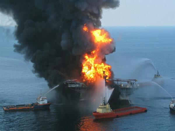 Photo: Platform supply vessels shoot water at the fiery remnants of the off shore oil rig Deepwater Horizon