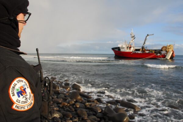Photo: Pacific Strike Team member, Chief Petty Officer Alan Dooley, observes fuel-lightering operations on a grounded fishing vessel on St. George Island, Alaska.