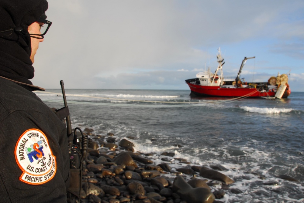 Photo: Pacific Strike Team member, Chief Petty Officer Alan Dooley, observes fuel-lightering operations on a grounded fishing vessel on St. George Island, Alaska.