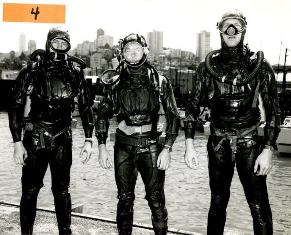 Photo: Three divers posing in their scuba gear.