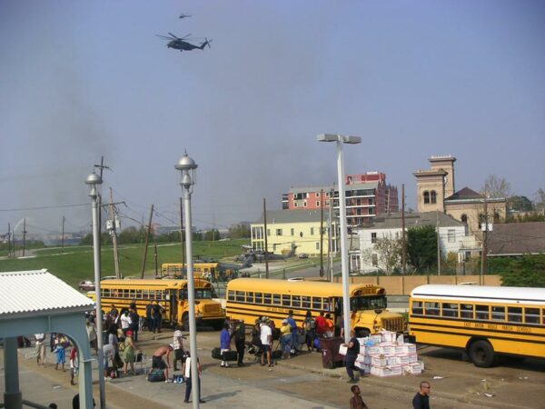 Photo: School buses assemble to evacuate displaced persons near the landing zone at the Algiers Ferry Terminal.