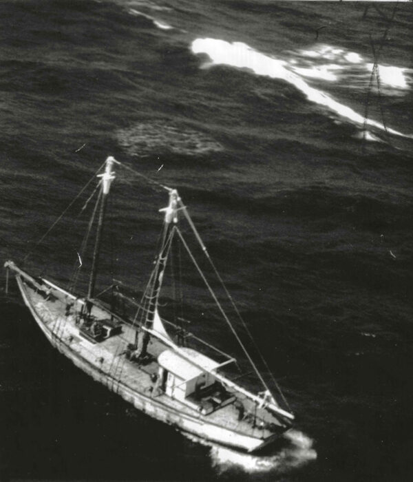 Aerial photo of Dell G with the caption “(MB1) Mobile, Ala., Oct. 22.-DISABLED FISHING VESSEL RIDES OUT HURRICANE—The disabled fishing vessel Dell G of Mobile wallows in heavy seas in the gulf Wednesday after riding out Hurricane Laurie. The picture was made from a Coast Guard plane orbiting over the 67-foot vessel about 275 miles south of Mobile. A Coast Guard cutter is to tow her to port. (OFFICIAL COAST GUARD PICTURE) (AP WIREPHOTO) (sa41815apCG) 1969”
