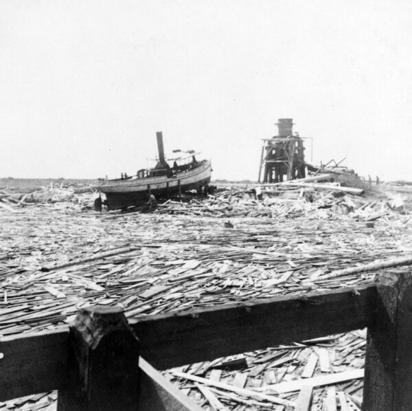 Photo: A lone steamboat sits in the midst of wreckage at Galveston waterfront.