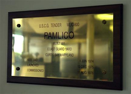 Photo: Nameplate displays the text: U.S.C.G. TENDER, WLIC-800 – PAMLICO – BUILT BY COAST GUARD YARD CURTIS BAY, MARYLAND – KEEL LAID 1 JUN 1974 – LAUNCHED 13 DEC 1975 – COMMISSIONED 11 AUG 1976”