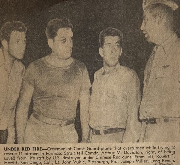 Newspaper photo clipping of four men. Caption reads: UNDER RED FIRE—Crewmen of the Coast Guard plane that overturned while trying to rescue 11 airmen in Formosa Strait tell. Commander Arthur M. Davidson, right, was saved by a life raft from a U.S. destroyer under Chinese Red guns. From left, Petty Officer 3rd Class Robert F. Hewitt, San Diego, California.; Lieutenant John Vukic, Pittsburgh, Pennsylvania.; and Petty Officer 3rd Class Joseph Miller, Long Beach, California.