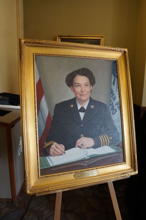 Photo: A painting of CAPT Stratton in a gold frame on display.