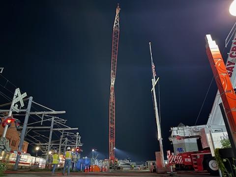 Photo: The construction team completes setting up crane at night.