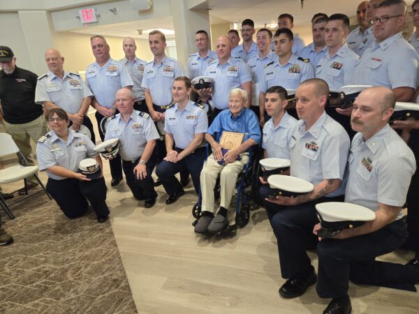 Photo: Jack Hamlin poses with Coast Guard service members.