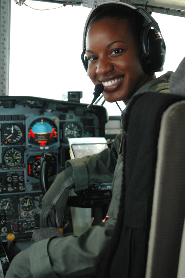 Photo: Lt. j.g. Jeanine McIntosh-Menze, a Coast Guard C-130 Hercules aircraft pilot sits at the controls.